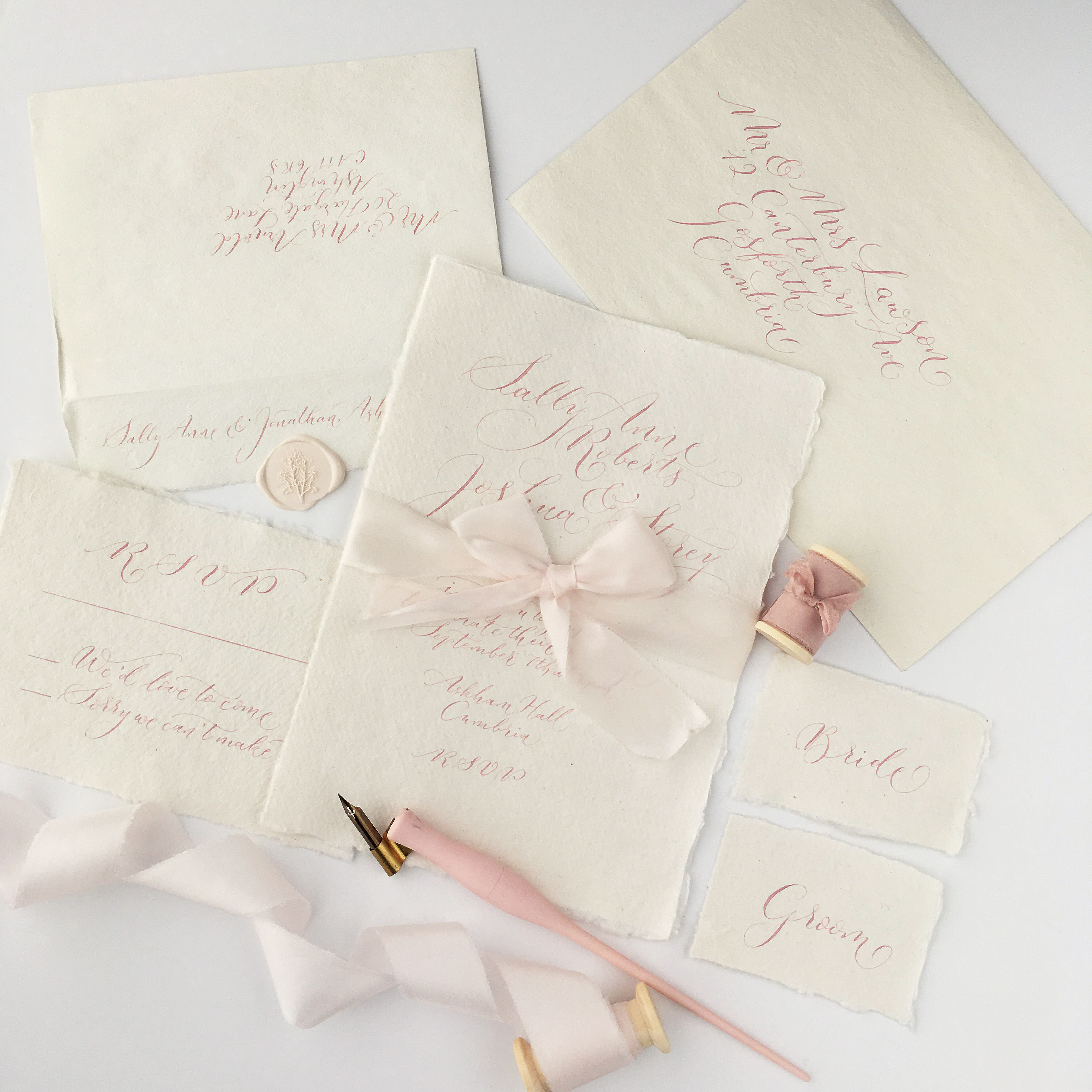 bespoke wedding calligraphy stationery suite on soft artisan paper stock with silk ribbon