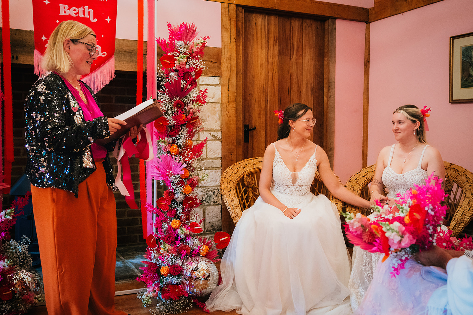 Photos from a colourful pink and orange glitter ball wedding near Westbury by Becky Weir Photography