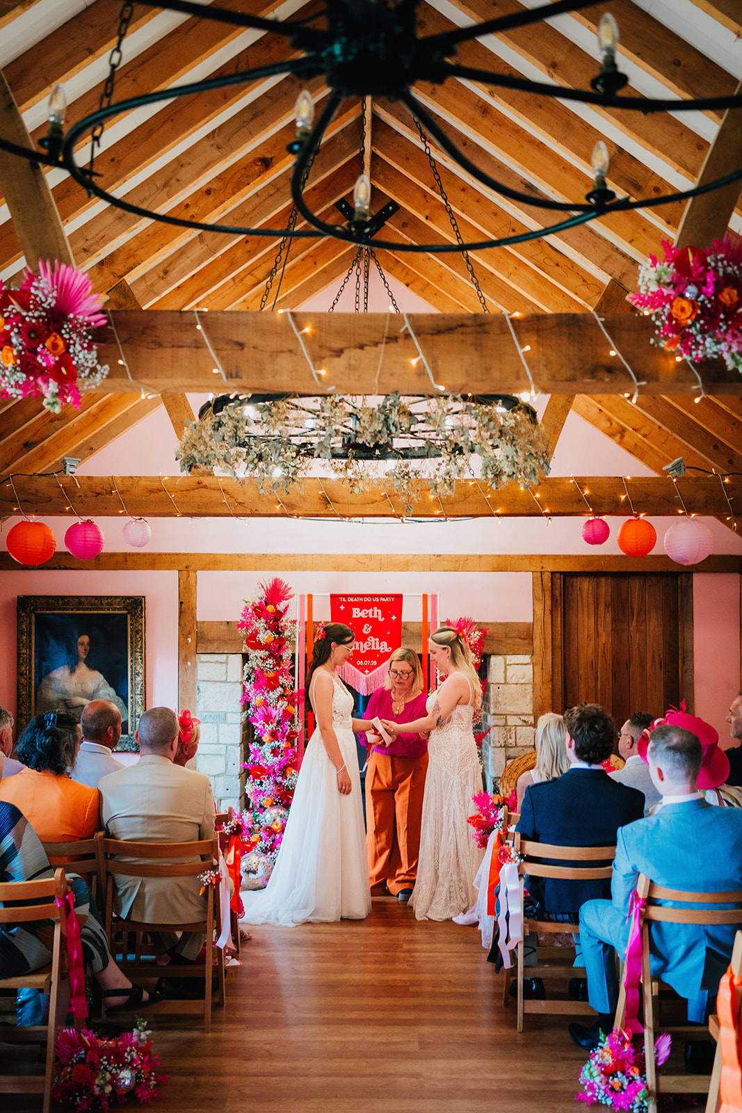 Photos from a colourful pink and orange glitter ball wedding near Westbury by Becky Weir Photography