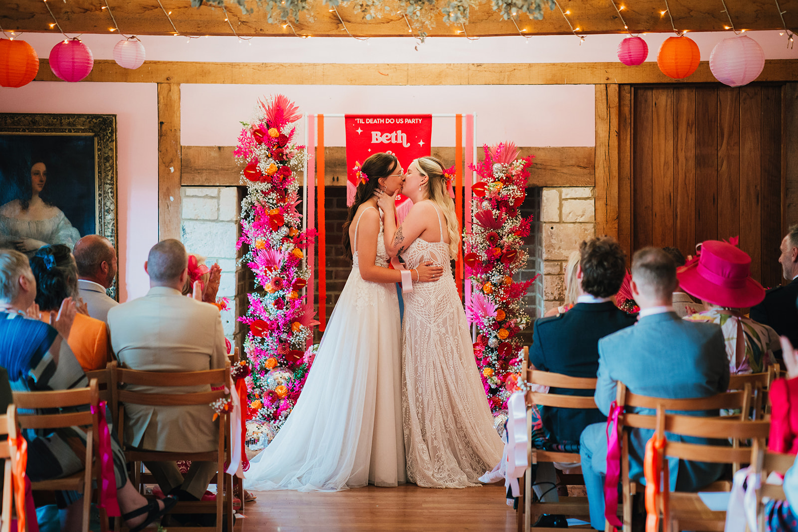 Photos from a colourful pink and orange glitter ball wedding near Westbury by Becky Weir Photography