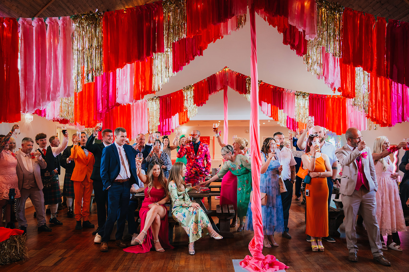 Photos from a colourful pink and orange glitter ball wedding near Westbury by Becky Weir Photography