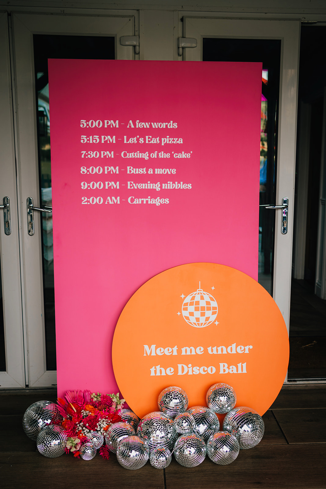 Photos from a colourful pink and orange glitter ball wedding near Westbury by Becky Weir Photography