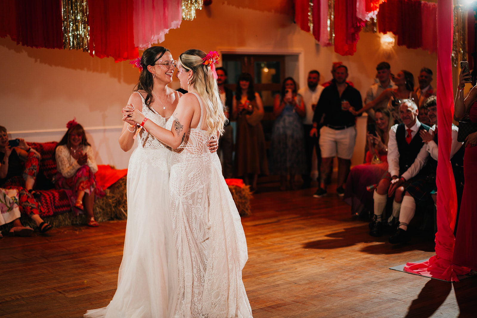 Photos from a colourful pink and orange glitter ball wedding near Westbury by Becky Weir Photography