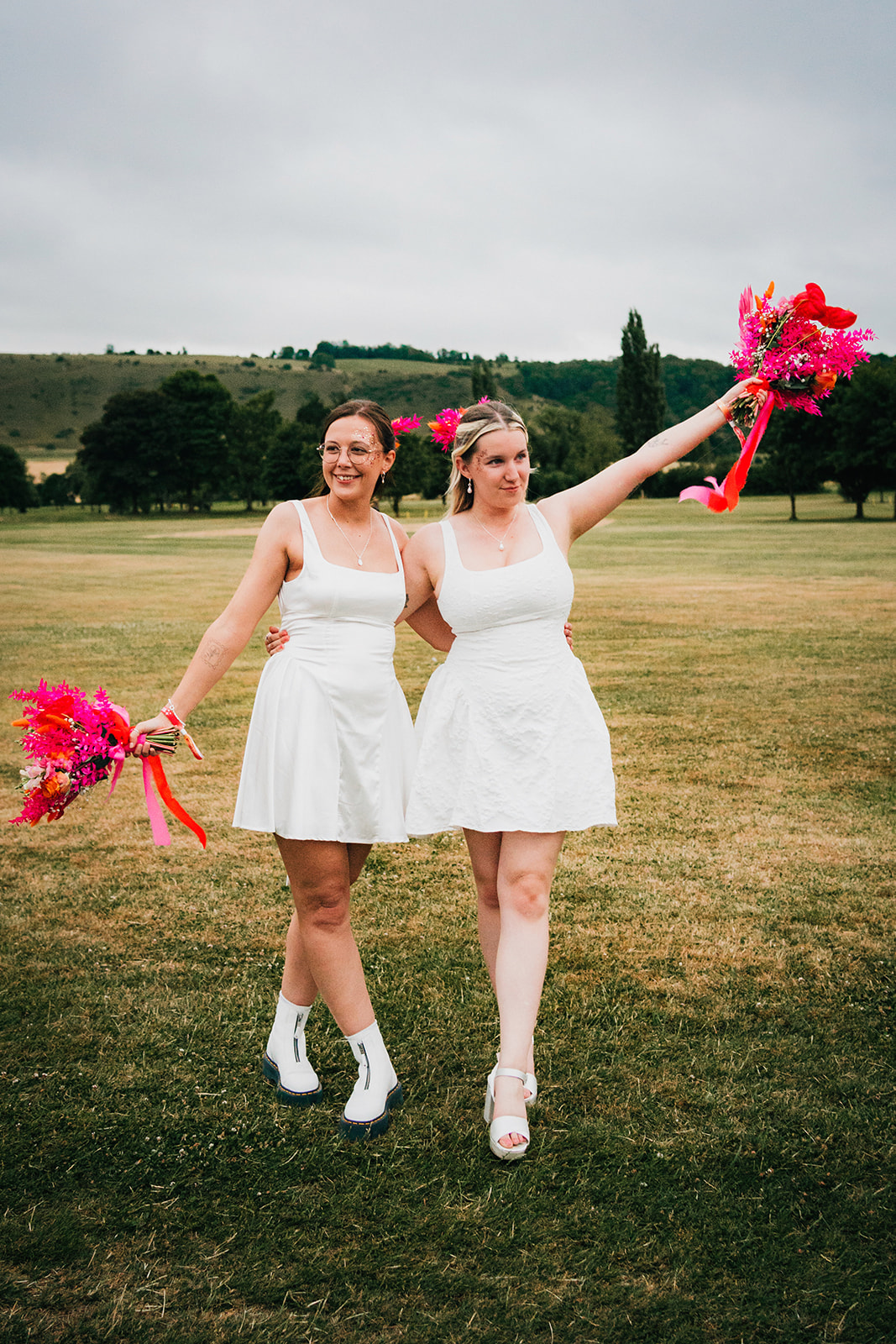 Photos from a colourful pink and orange glitter ball wedding near Westbury by Becky Weir Photography