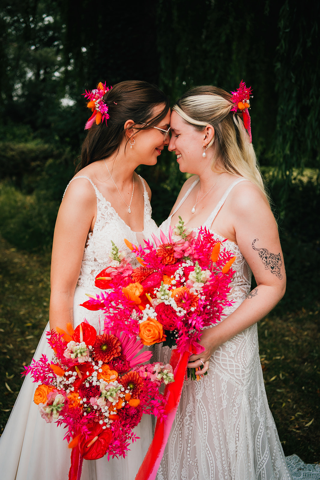 Photos from a colourful pink and orange glitter ball wedding near Westbury by Becky Weir Photography