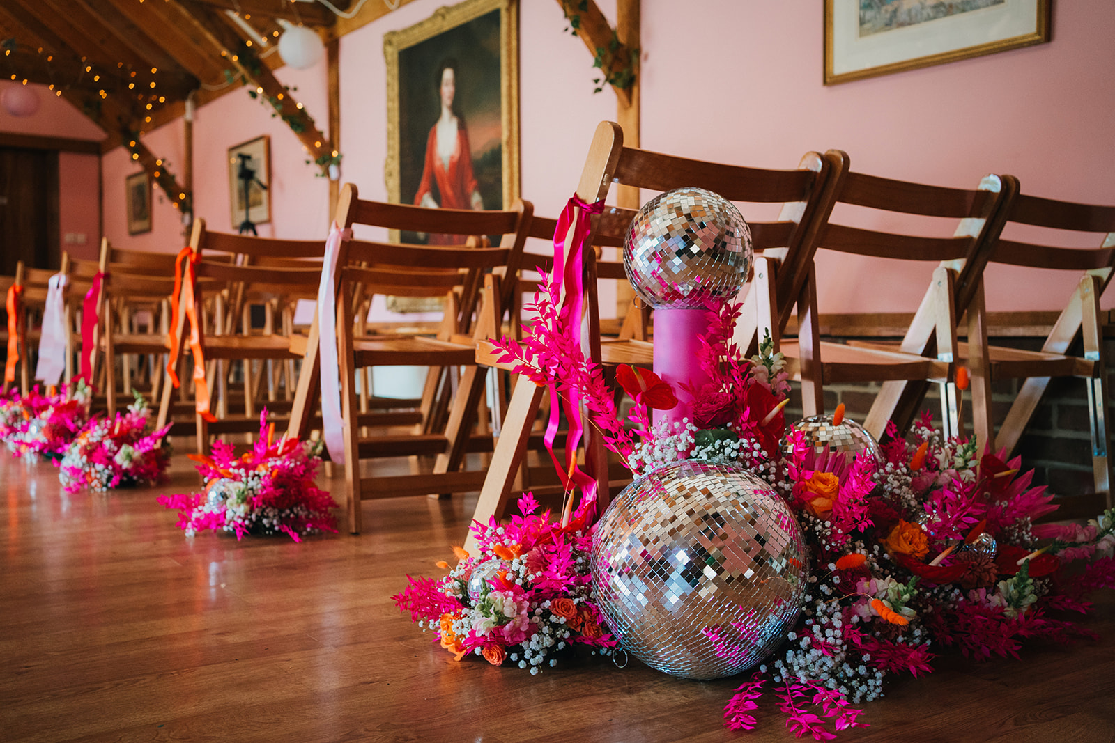 Photos from a colourful pink and orange glitter ball wedding near Westbury by Becky Weir Photography