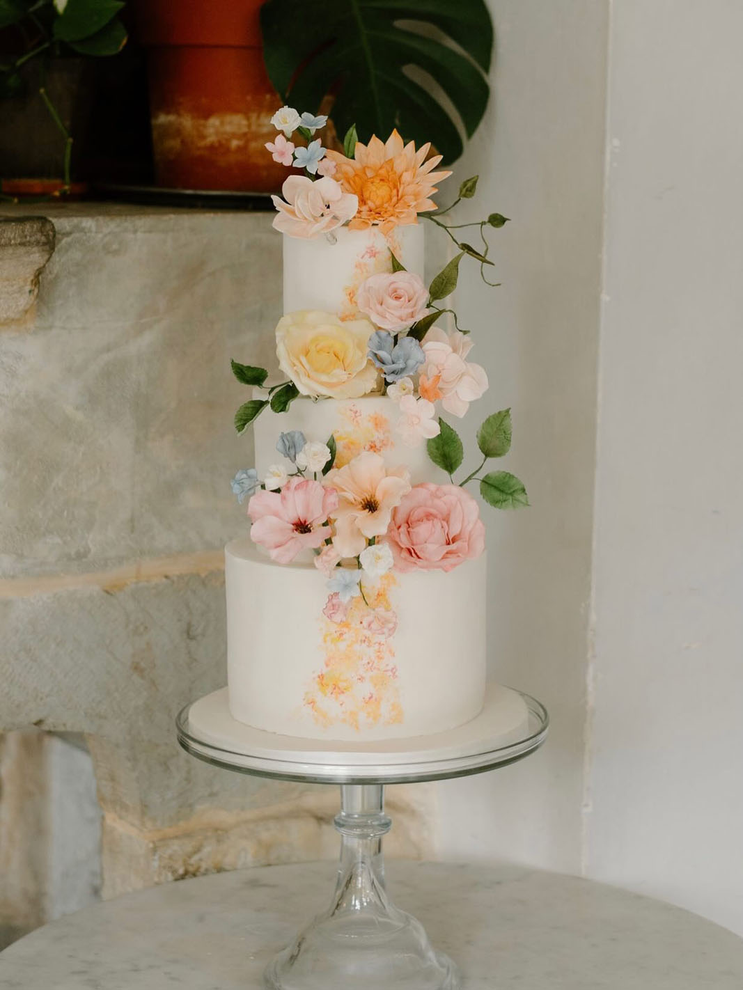 colourful sugar paste flowers on a three tier wedding cake