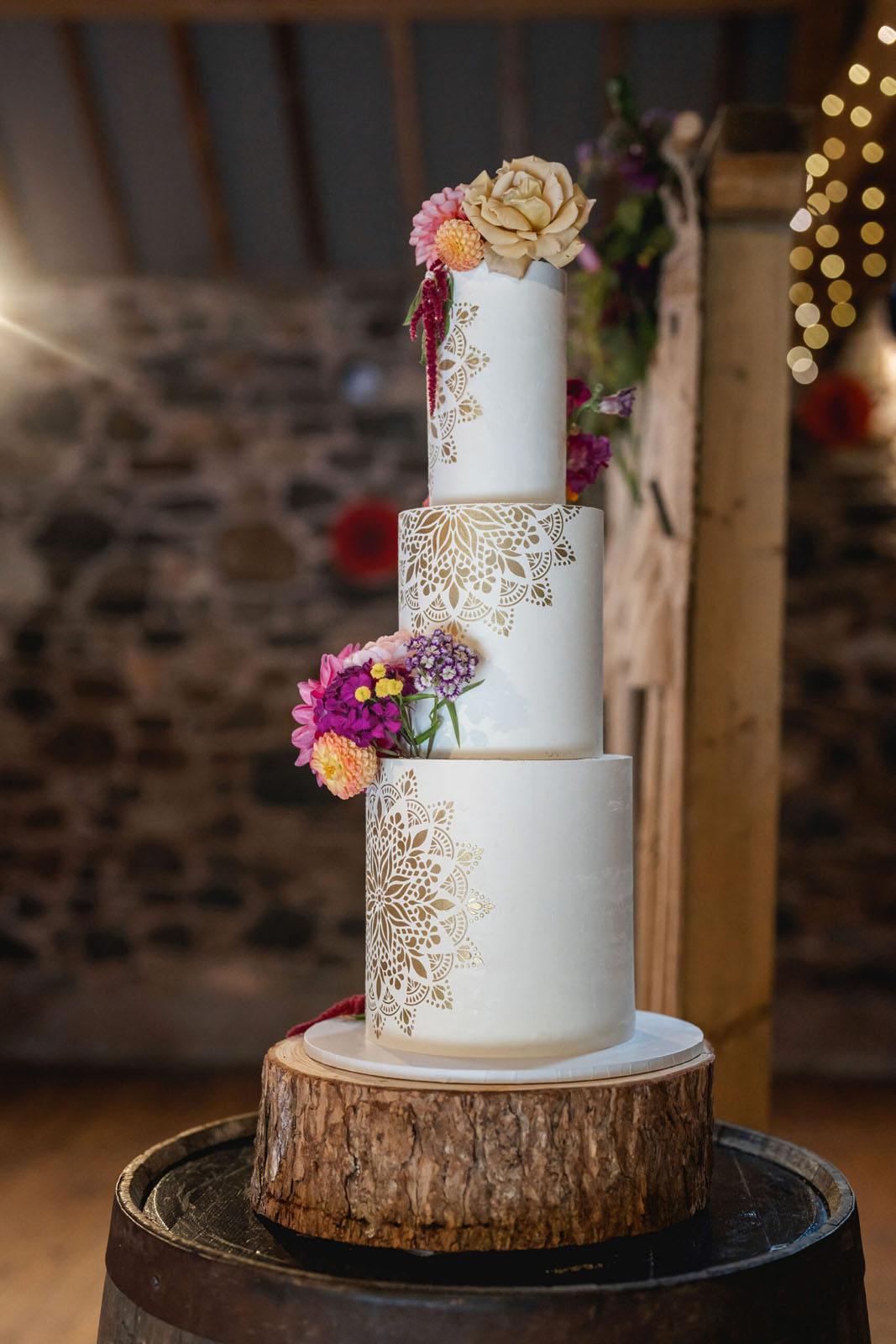tiered wedding cake with gold pattern design