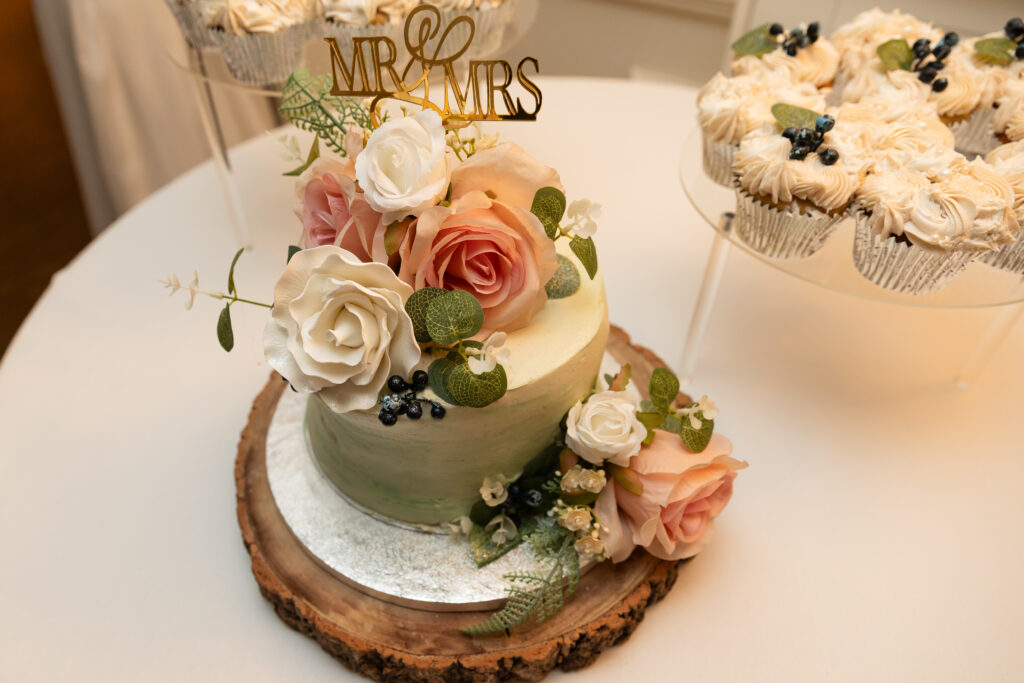 Wedding cake and cupcakes for an intimate wedding at Southdowns Manor by Cupcake Culture image by Anna Rainbow Photography