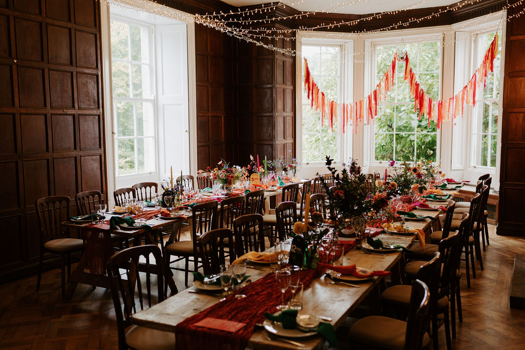 Colourful DIY wedding with streamers and stunning flowers at Colehayes Park South Devon with Hannah Timm Photography