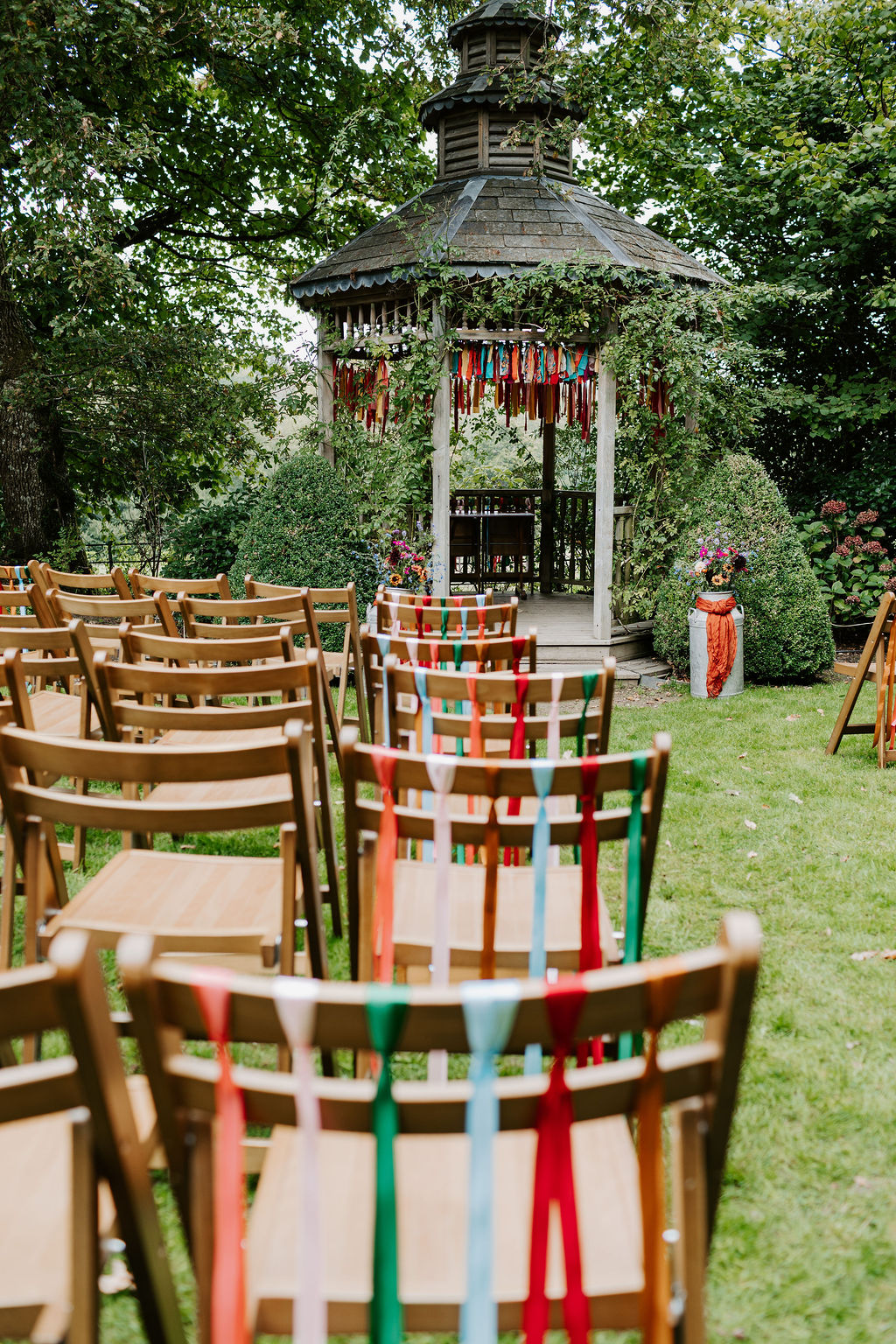 Colourful DIY wedding with streamers and stunning flowers at Colehayes Park South Devon with Hannah Timm Photography