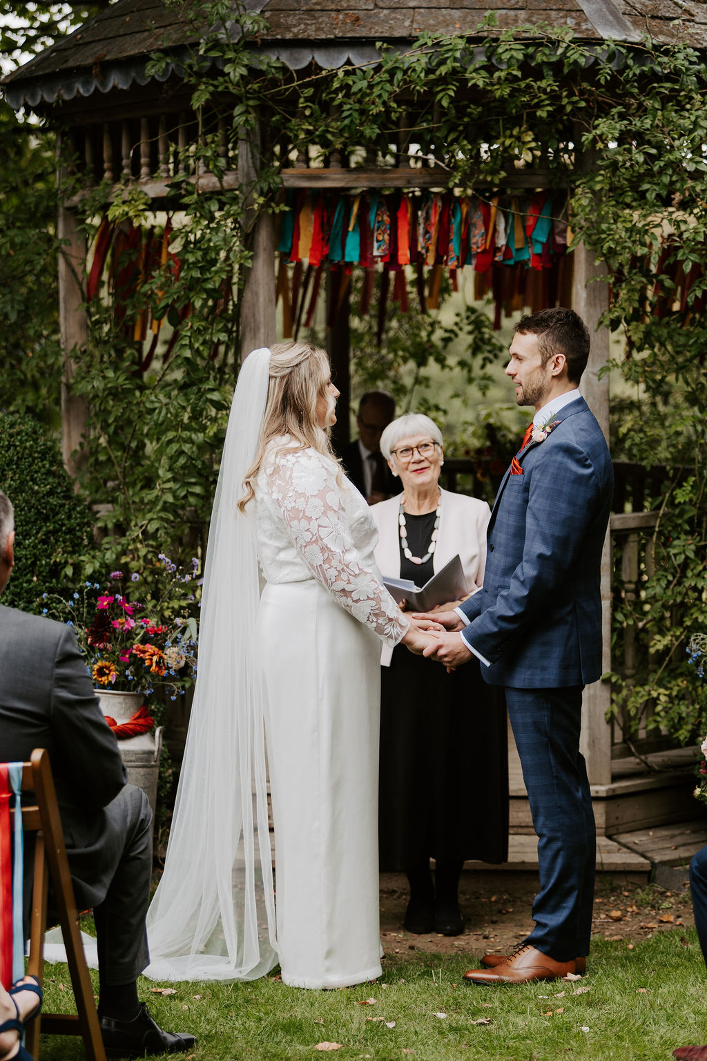 Colourful DIY wedding with streamers and stunning flowers at Colehayes Park South Devon with Hannah Timm Photography
