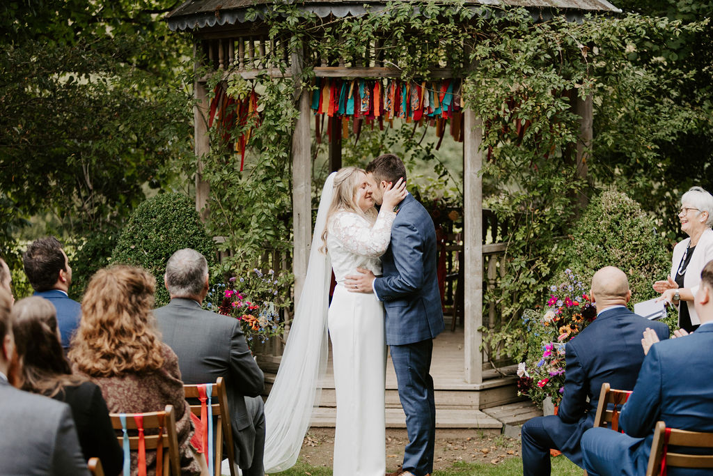Colourful DIY wedding with streamers and stunning flowers at Colehayes Park South Devon with Hannah Timm Photography