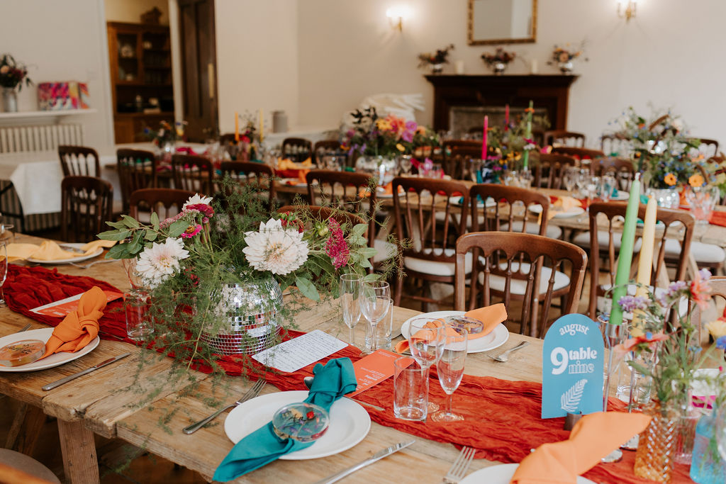 Colourful DIY wedding with streamers and stunning flowers at Colehayes Park South Devon with Hannah Timm Photography