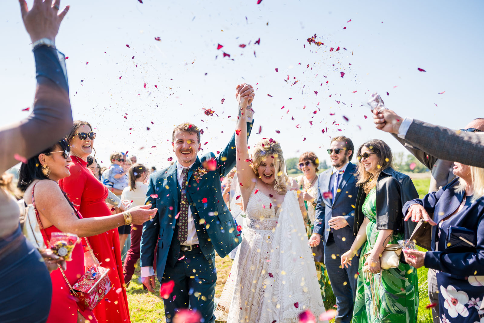 Confetti joy moment for newlyweds at Wilderness Wedding venue - Benjamin Toms Photography | Kent