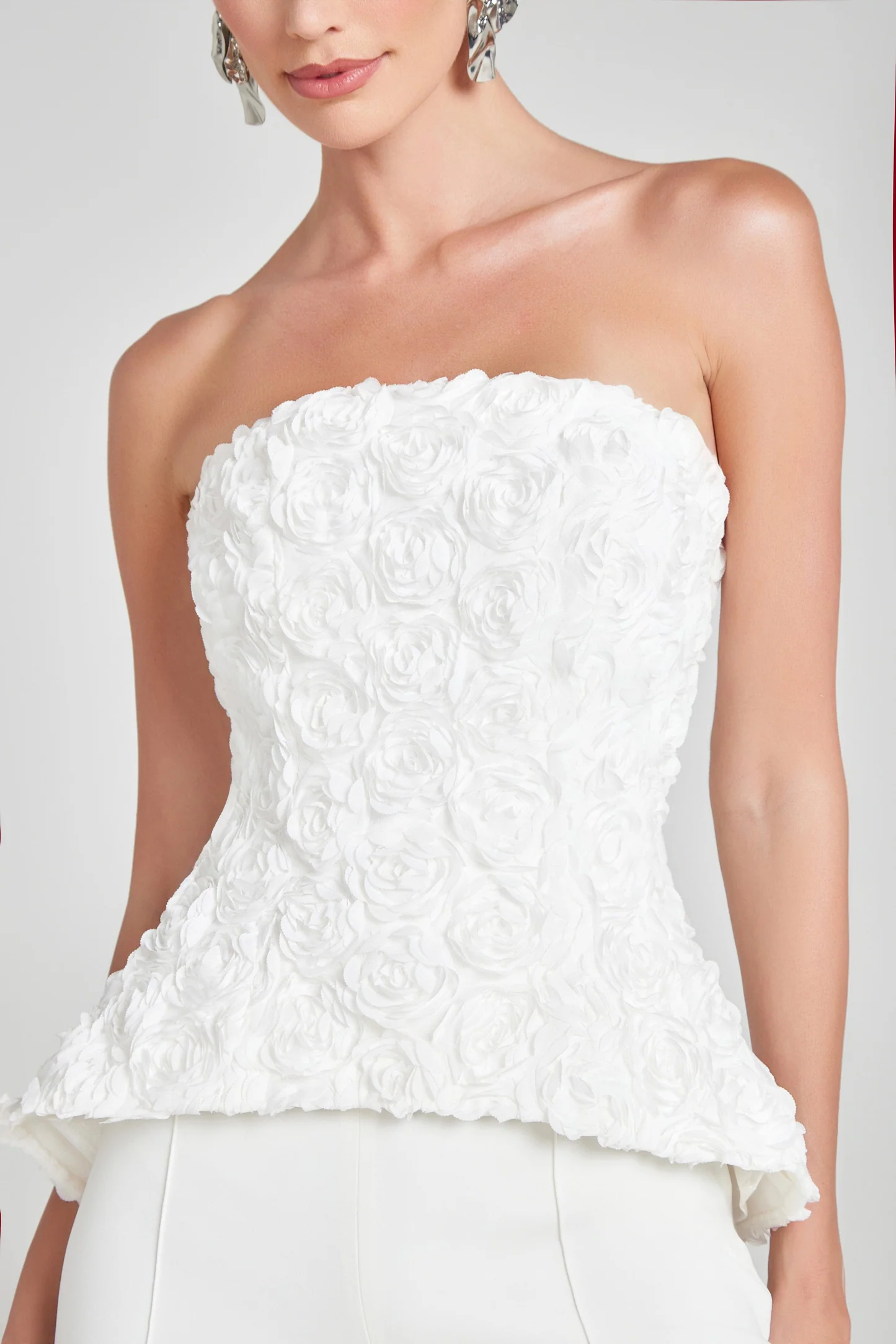 Flower embellished applique strapless top by Nadine Merabi