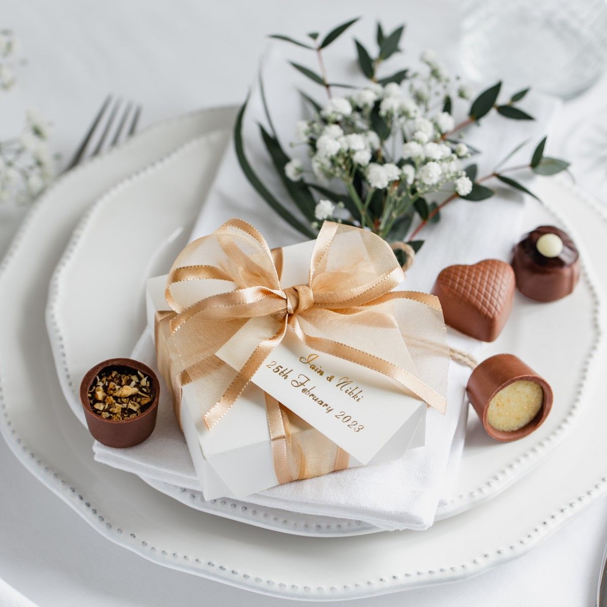 wedding plate with gift wrapped favour box and 4 chocolates by Lily O'Briens