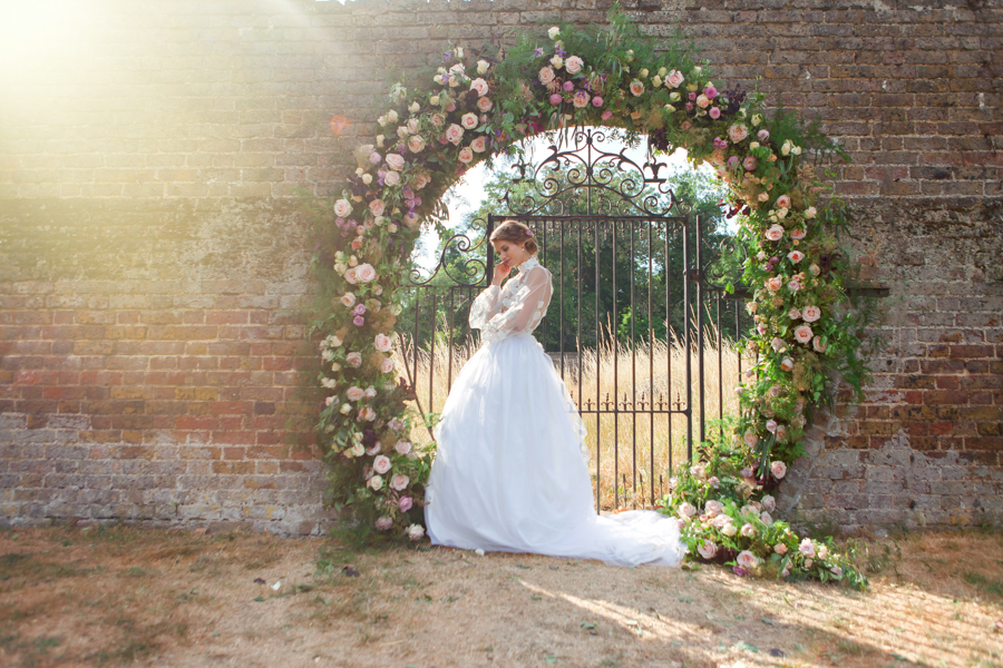 Stunning florals and archway flower surround for a breathtaking wedding style article on English Wedding, image credit Lisa Payne Photography (38)