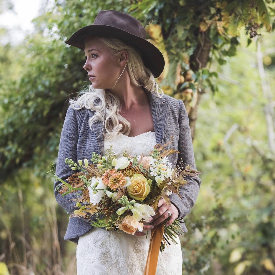 Alternative bride with summer bouquet Captured by Katie Mortimore
