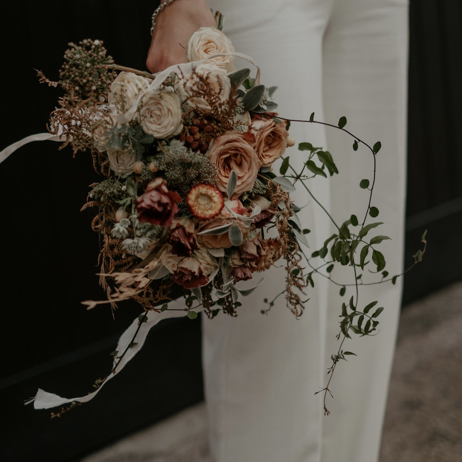 Modern bridal bouquet with loose stems of foliage Emily Robinson Photography