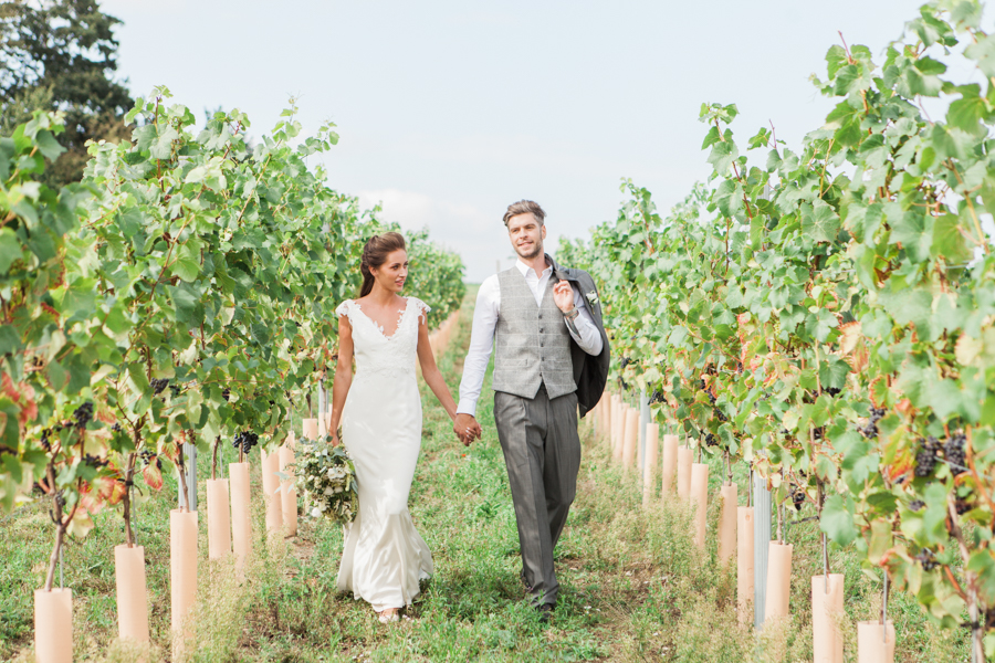Norfolk wedding inspiration with tumbling green foliage, olive branch styling and a bride and groom in relaxed casual outfits, image credit Amanda Karen Photography