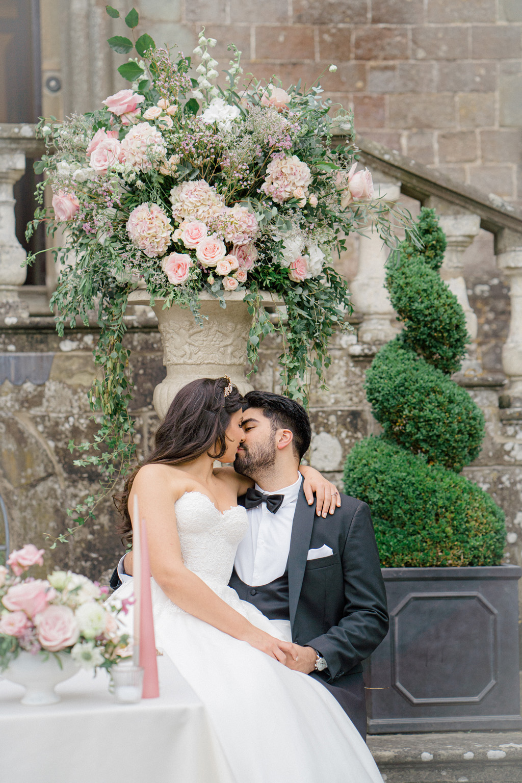 Clearwell Castle bride and groom photoshoot with white and pink floral inspiration