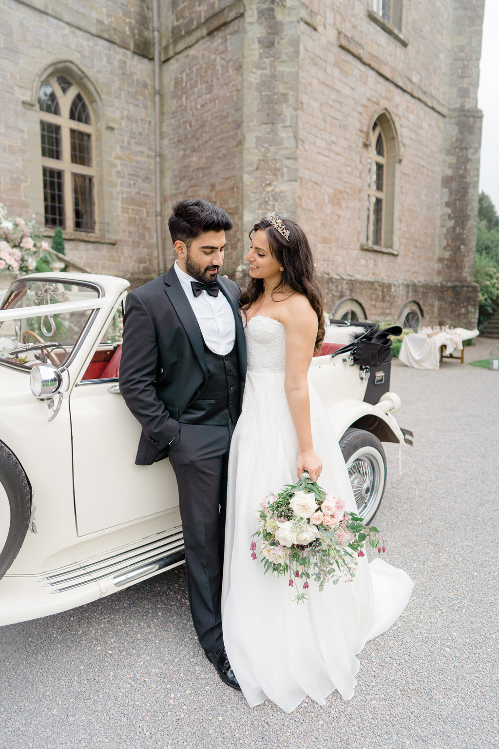 Clearwell Castle wedding blog bride and groom with table styling and extravagant styled florals