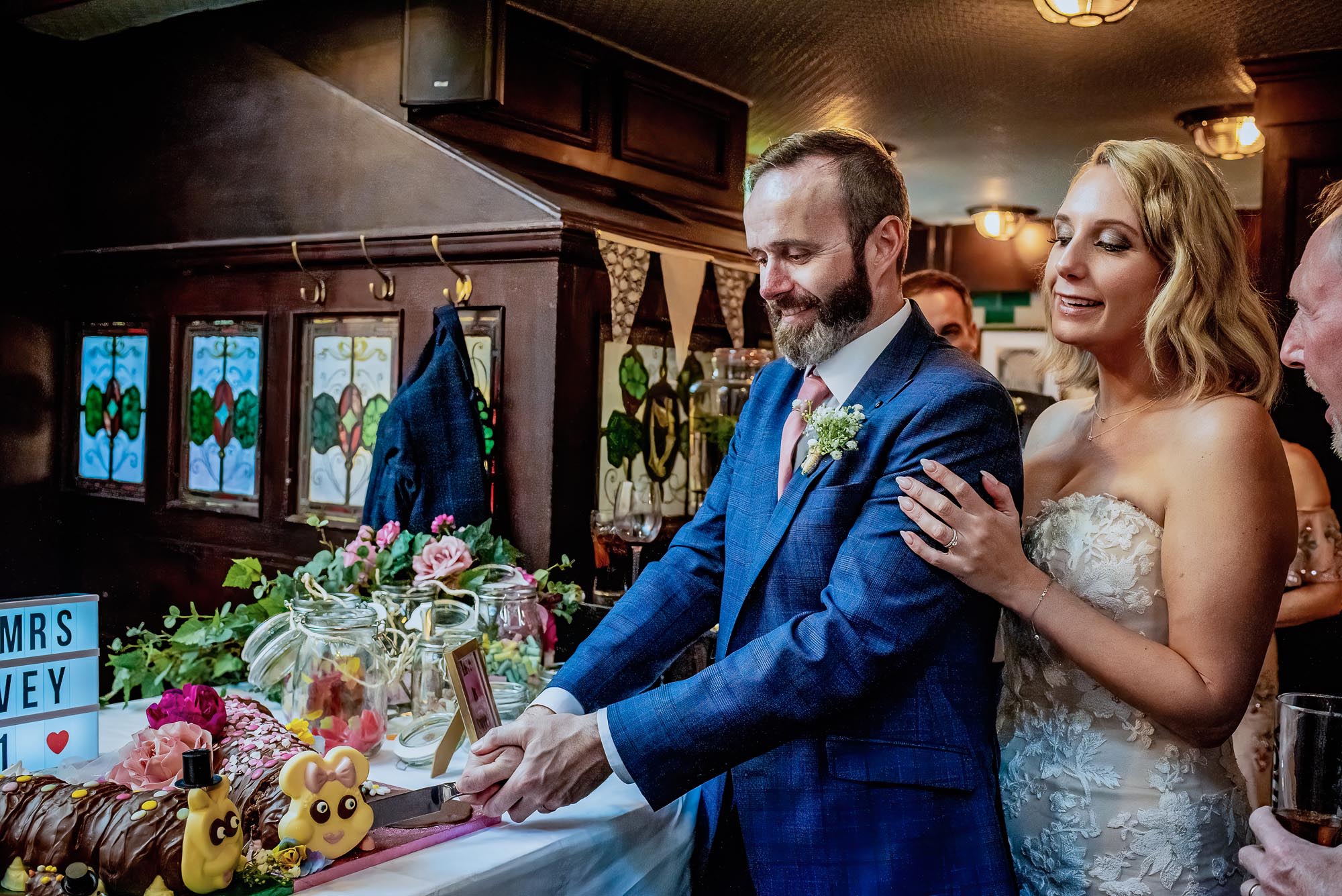 Chris and Sarah's London wedding with vibrant pink florals made by the bride. Photographer credit Damien Vickers Photography