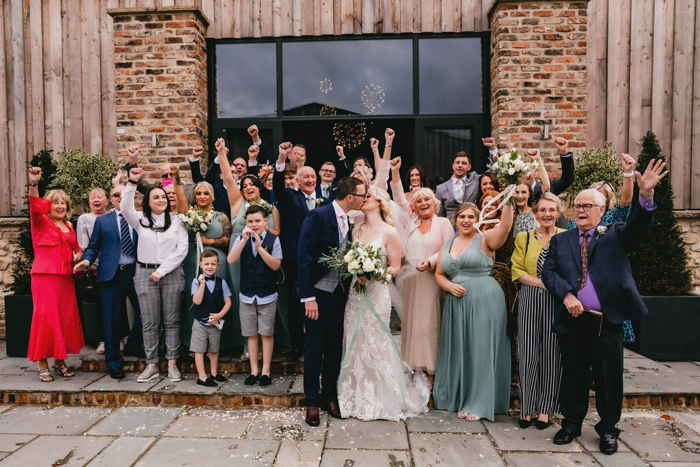 Katy and Ryan's Oakwood at Ryther wedding with lace embroidered dress and the groom wearing glasses. Credit Heather Butterworth Photography