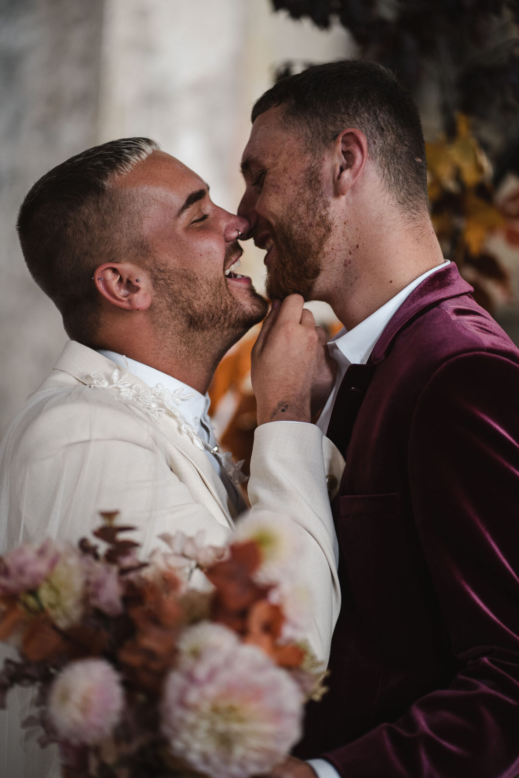 Romantic wedding photograph with a LGBTQ couple about to kiss. By Karolina Photography