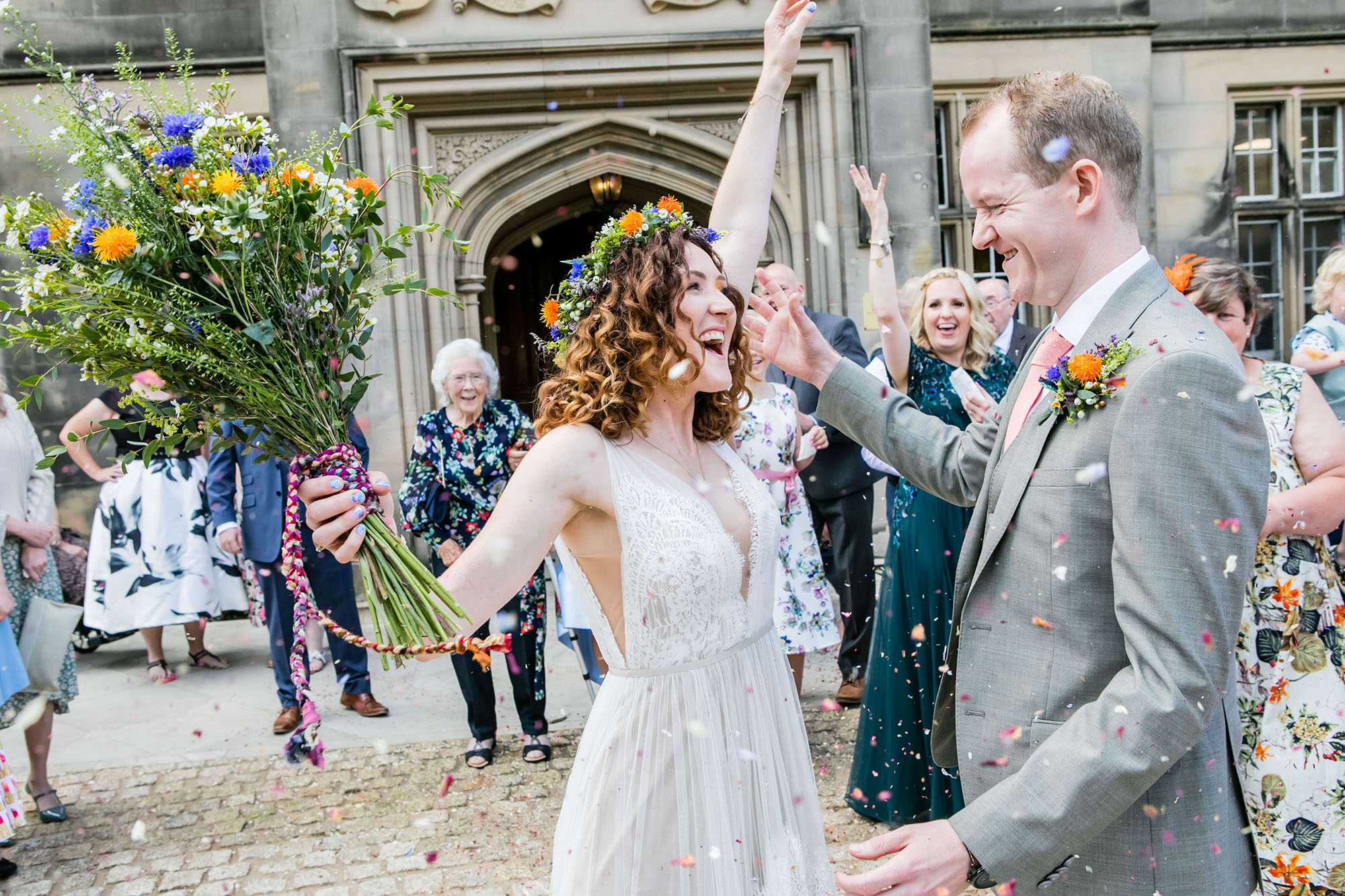 All the just married feels from a happy wedding photo outside the ceremony venue with Erika Tanith Photography Northumberland