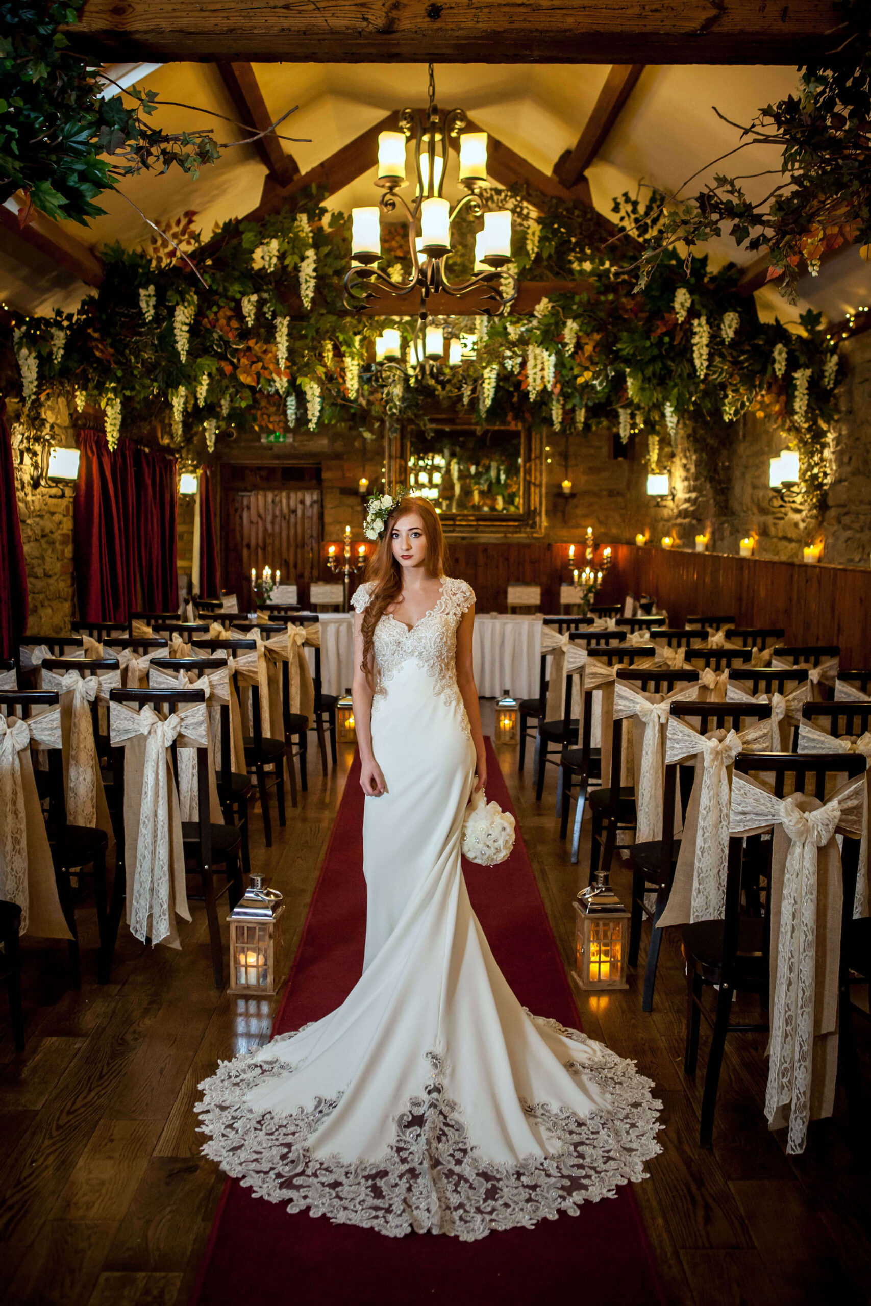 Bridal portrait with a long wedding dress in a luxury venue with magical lighting, by Erika Tanith Photography