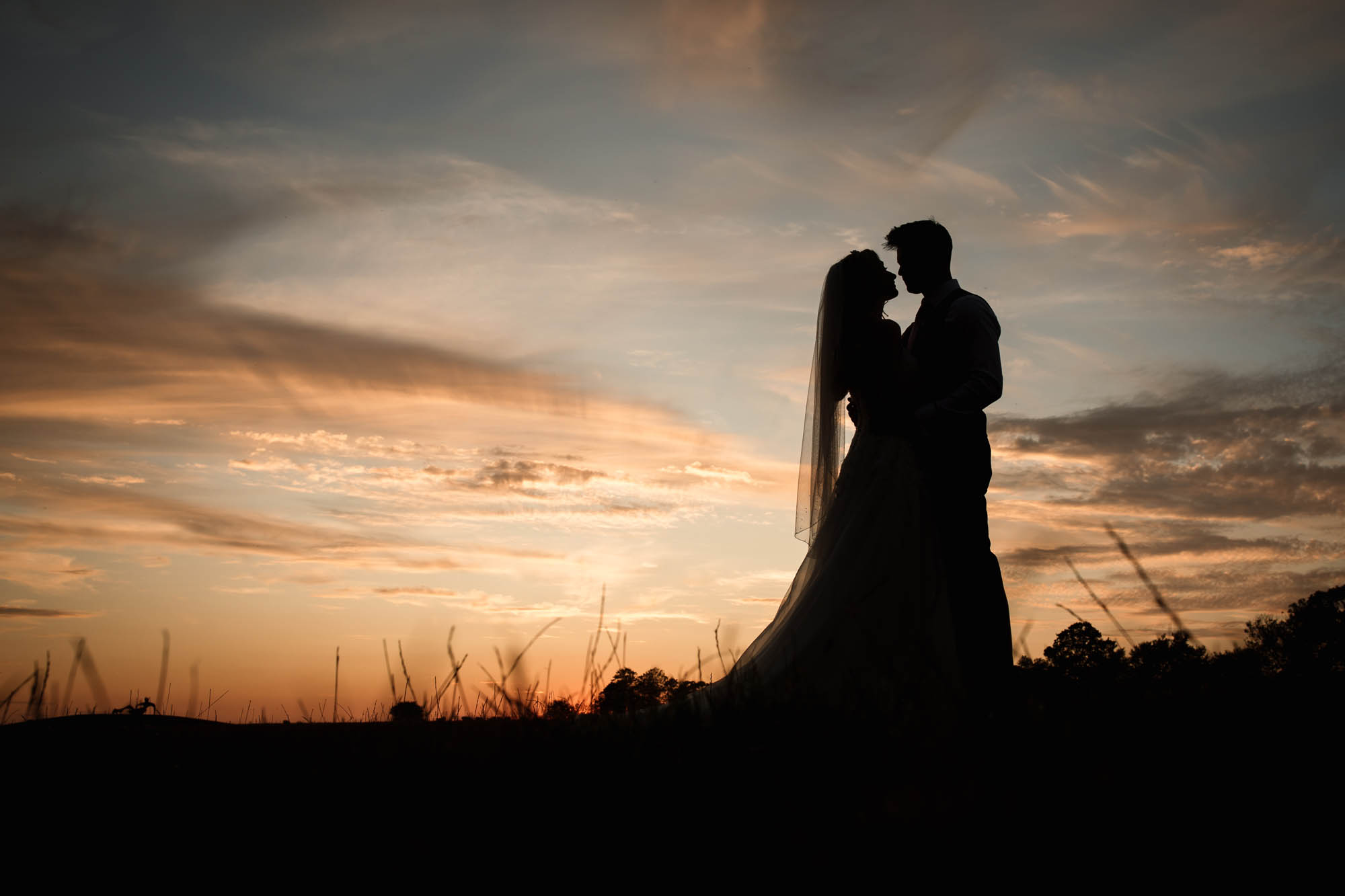 Golden hour wedding photography by Becky Harley in Hertfordshire. Couples bathed in golden light in beautiful surroundings on their wedding days.