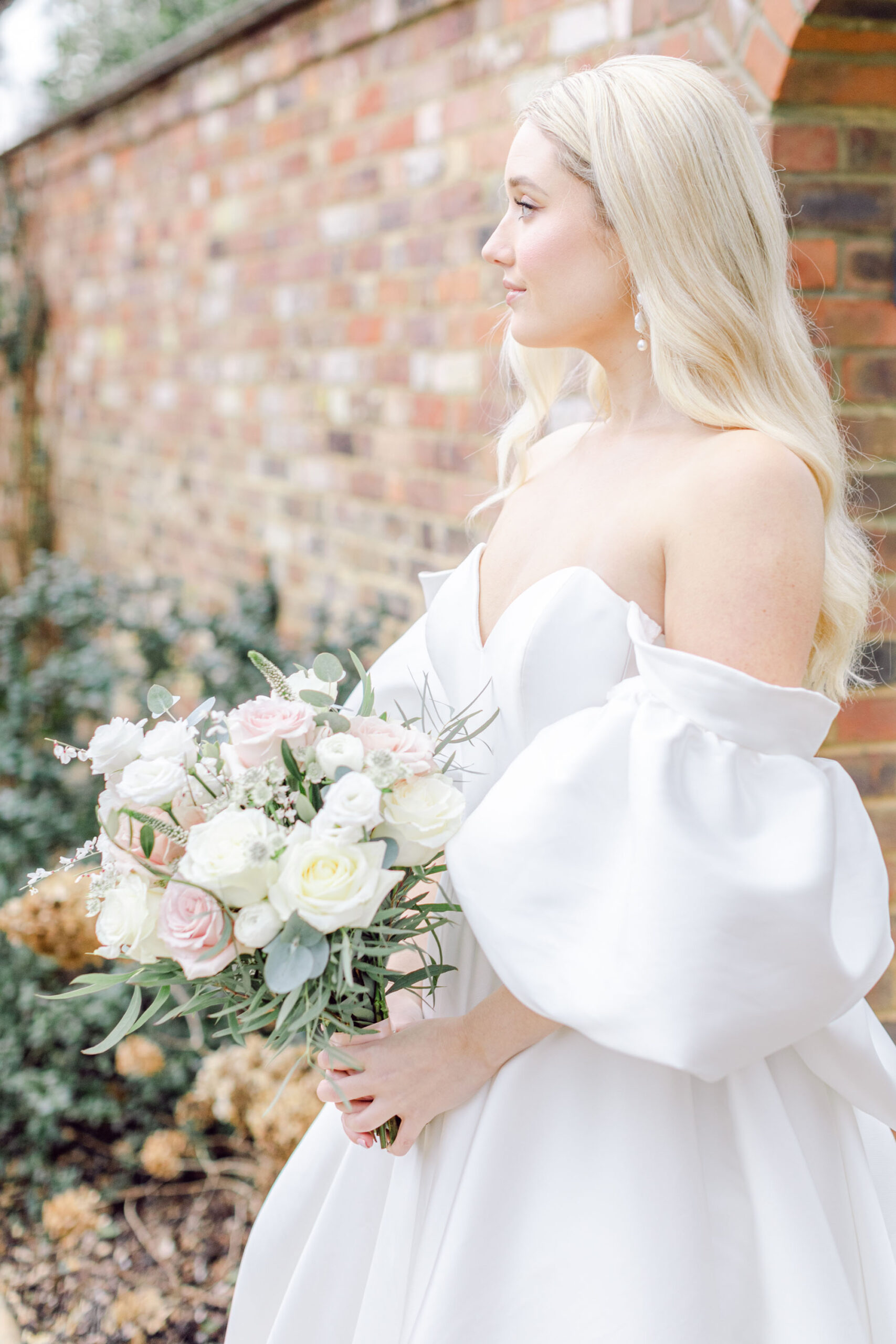 Light and airy fine art photography at Greentrees Estate. Our model bride wears an off the shoulder dress by Lyn Ashworth. Flowers are white and blush British botanicals. Image credit Natalie D Photography