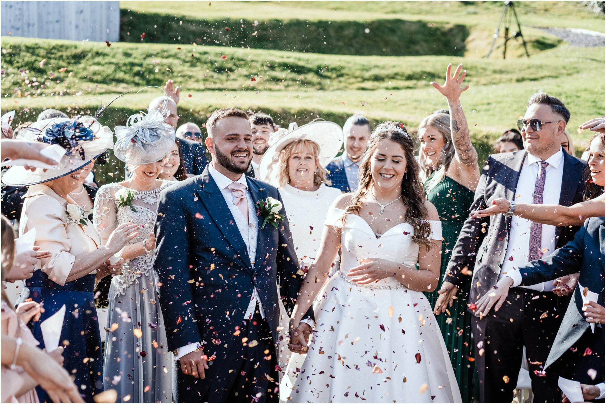Adam and Abbie's Sandy Cove wedding in Devon with an outdoor ceremony and elegant summer styling in ivory and blush