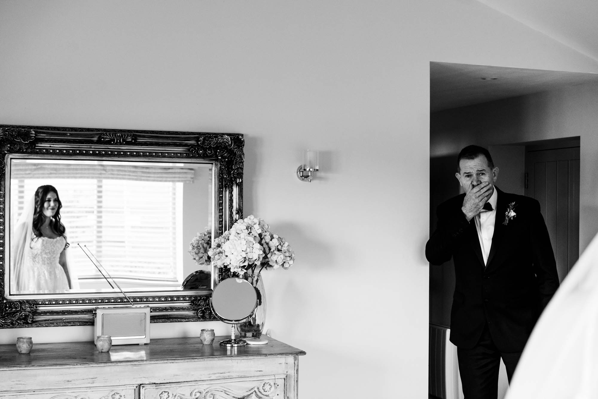 An emotional dad as he sees his daughter in her wedding dress for the first time - by Hannah Hall Photography