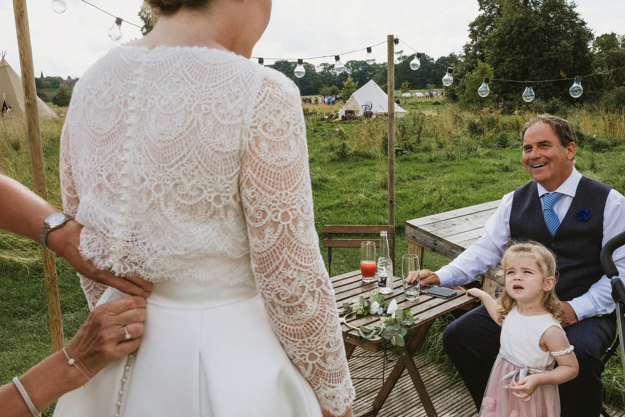 A favourite image from Sian & Sam's wedding which was at Home Farm Glamping, taken by top UK documentary wedding photographers York Place Studios