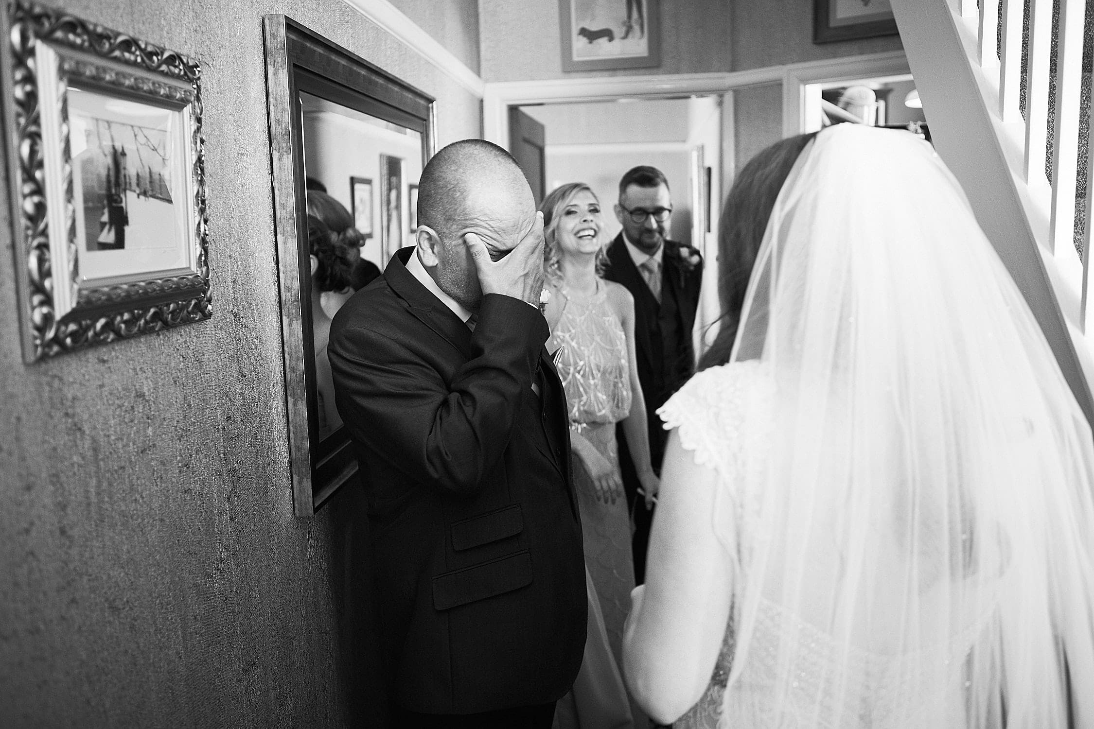 A dad is overwhelmed as he sees his daughter in her wedding dress for the first time. 166 Photography