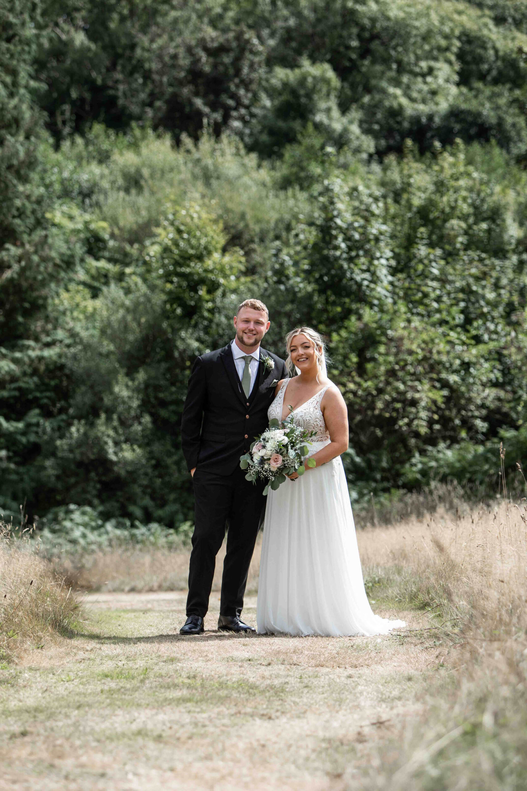 Newlyweds pose for the camera in Devon, with Snapdragon Photography