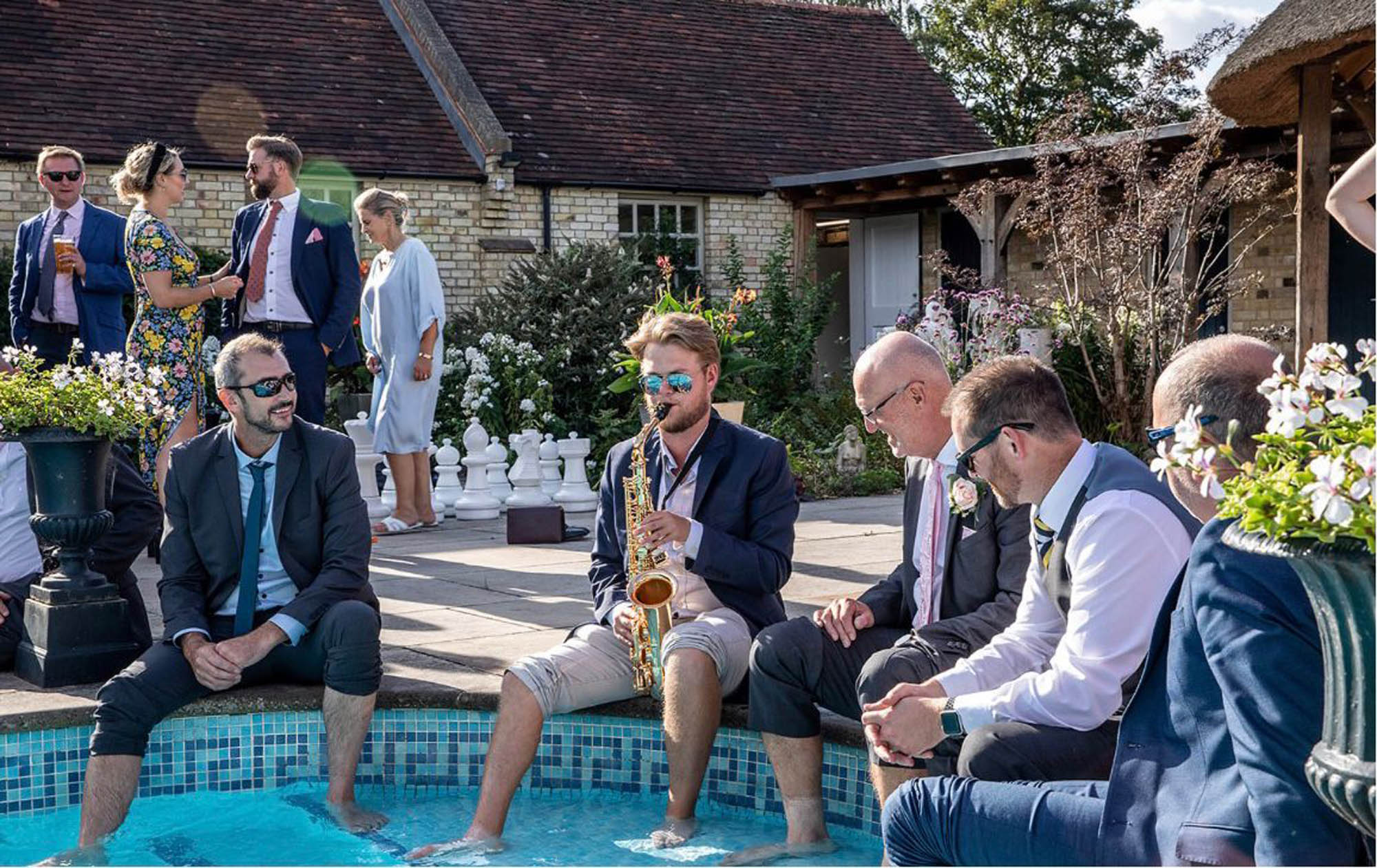 Bedfordshire manor house wedding venue Shortmead guests dipping toes in pool