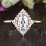 Vintage style, oval cut moissanite engagement ring, with halo