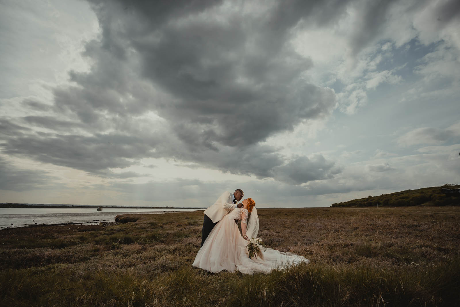 Stormy skies for a wedding photo at The Ferry House Kent