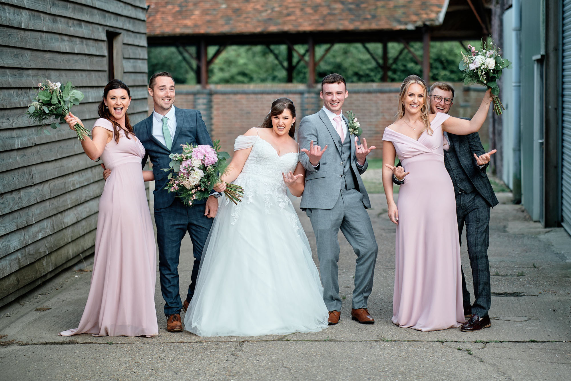 Wedding party posed photography by Howling Basset Photography in Kent