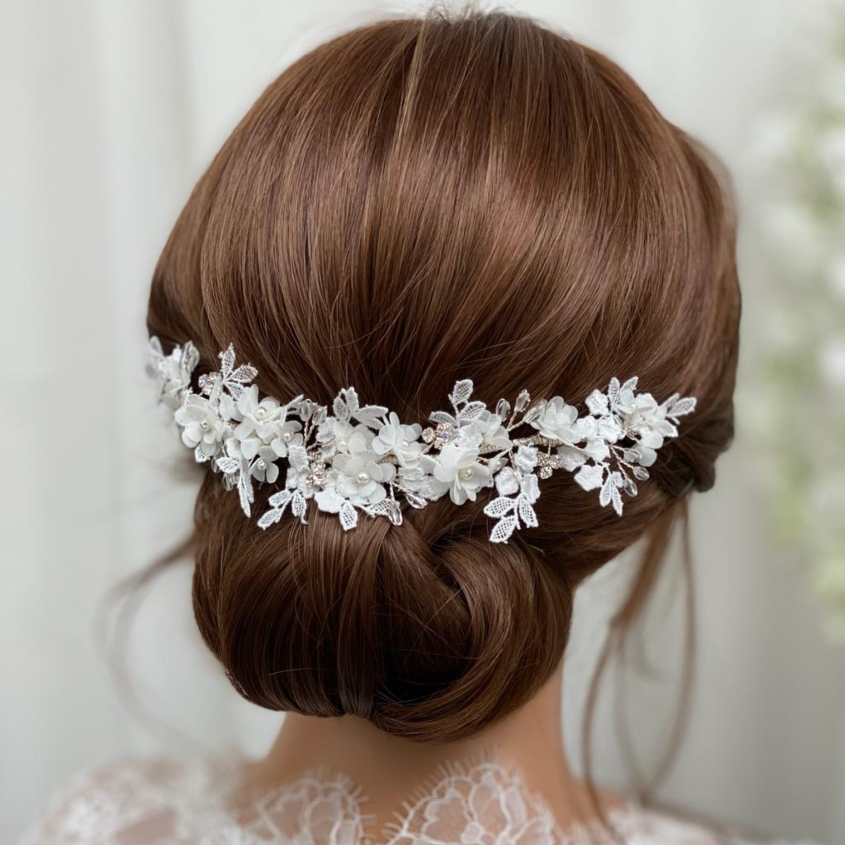 Boho bridal headpiece with lots of ivory flowers and lace