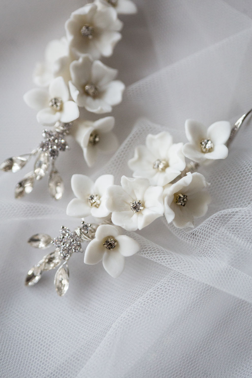 Delicate white floral bridal jewellery and hair accessories by Emma Rose