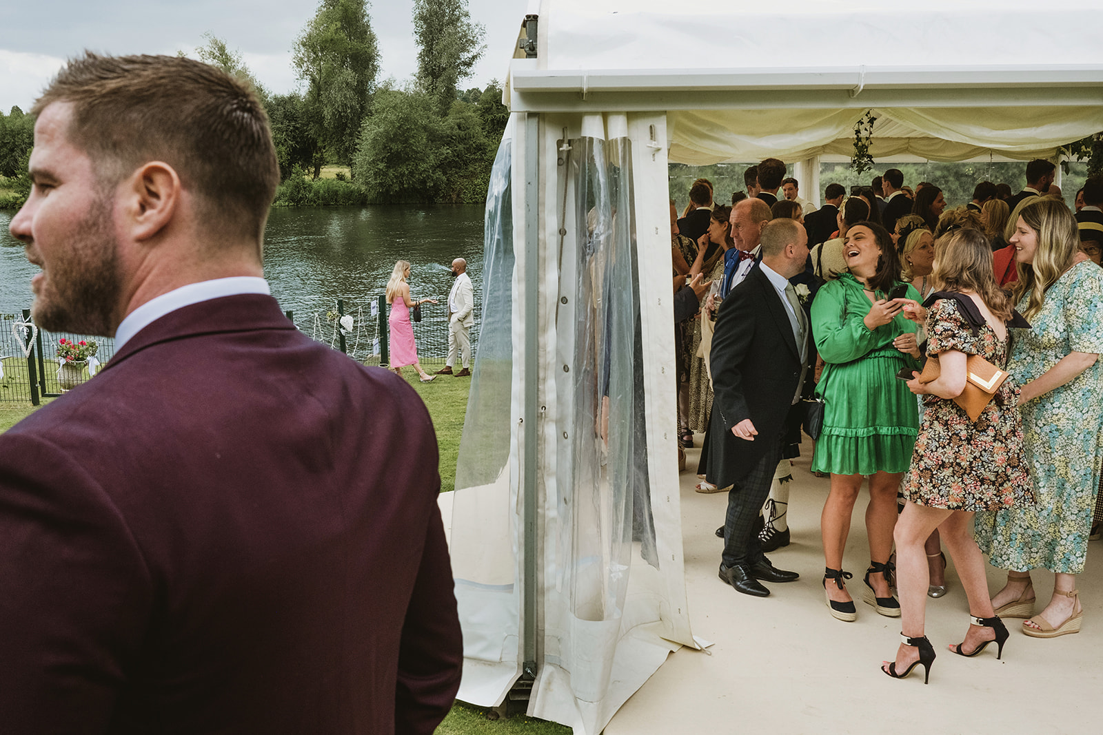 groom and bride celebrating with guests by award winning London documentary wedding photographers York Place Studios