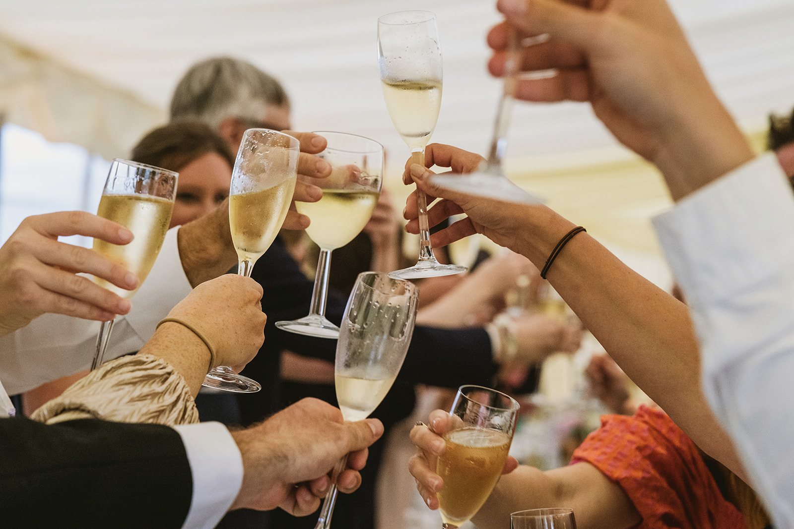 groom and bride celebrating with guests by award winning London documentary wedding photographers York Place Studios