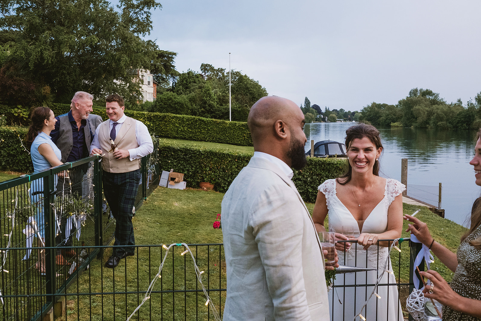 groom and bride celebrating with guests by award winning London documentary wedding photographers York Place Studios
