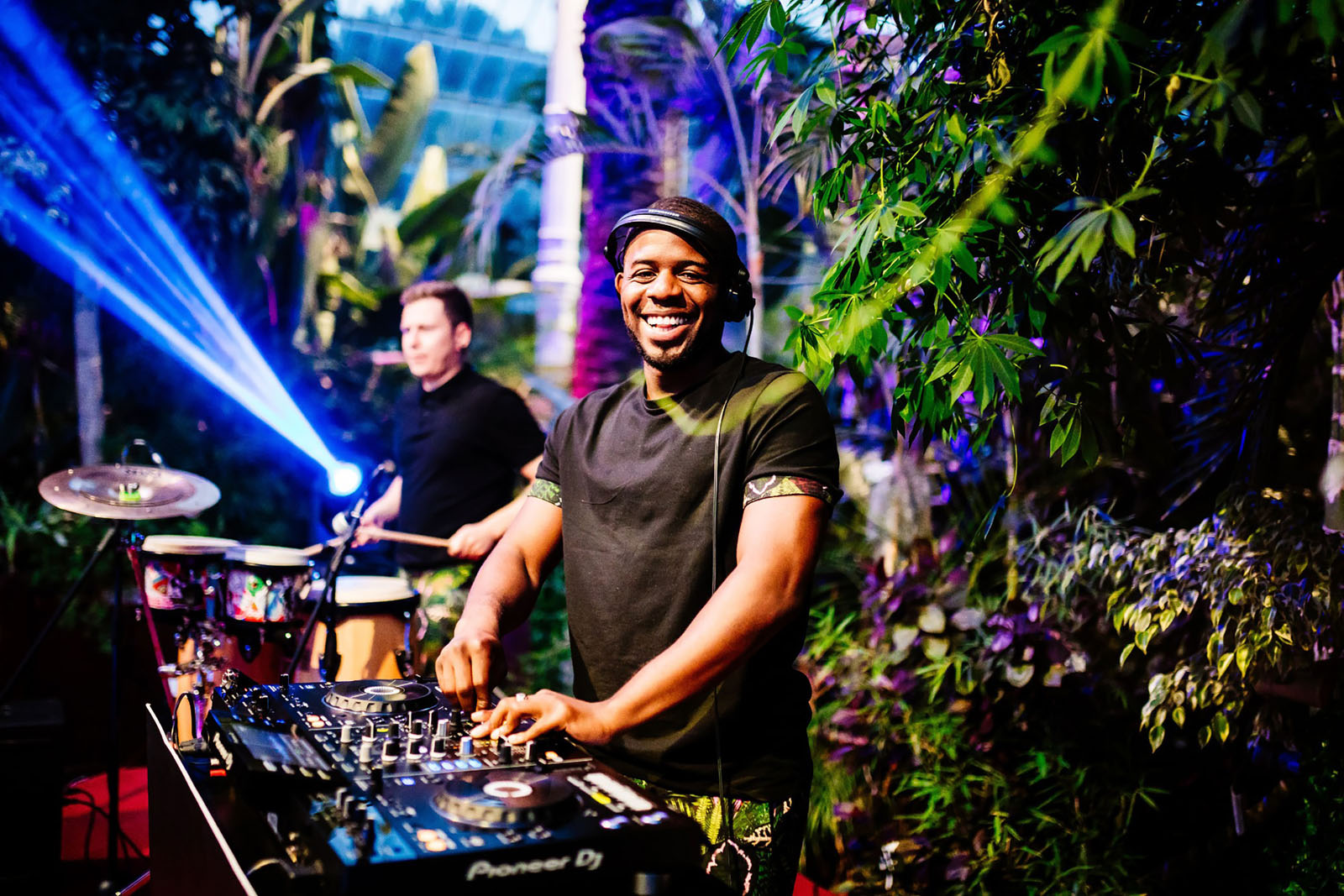 DJ grinning at the camera as he plays a wedding