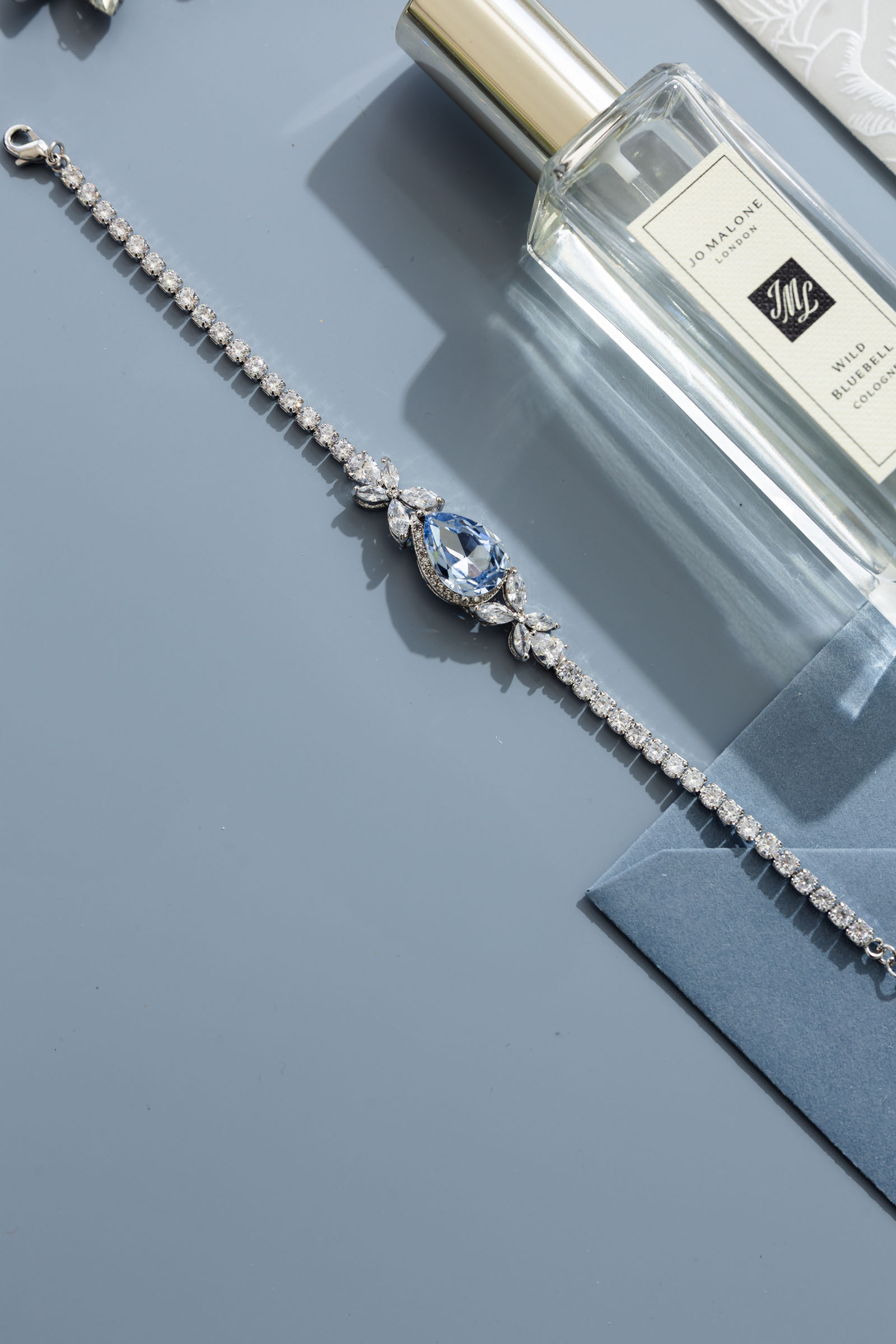 an assortment of pale, dusky and soft blue bridal jewellery and accessories made in the UK by Emma Rose Jewellery